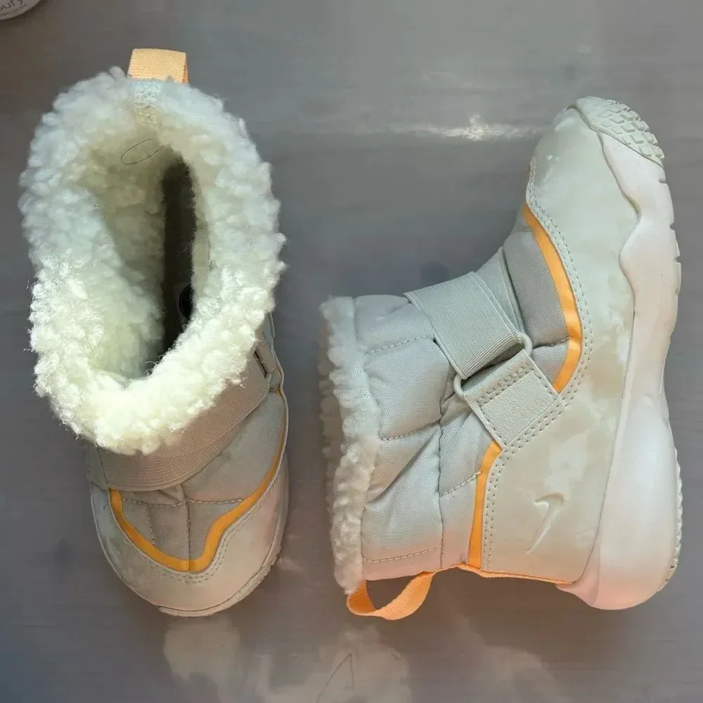 Nike Flex Advance boots in the 'Pale Ivory' or 'Melon Tint' colorway